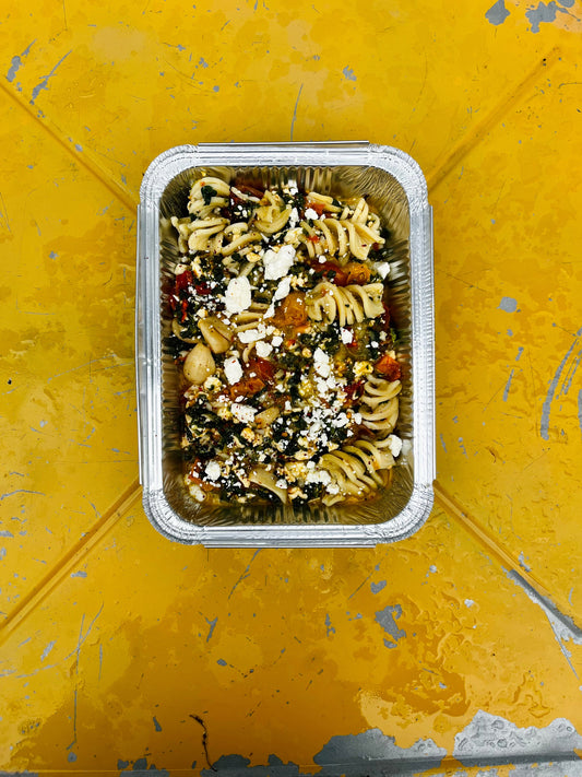 Smoked feta and tomato pasta bake with spinach and lemon