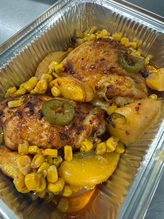 Roasted chicken thighs w/ peaches, corn & jalapeños