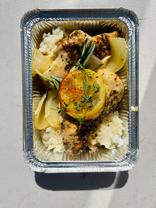 Roasted lemon chicken breasts with herbs and rice